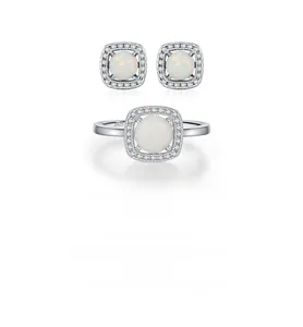 Macro detail of S925 sterling silver opal jewelry set showing rings and earrings