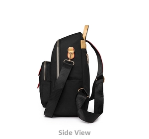 Side view of black nylon backpack with brown leather handle and red contrast stitching