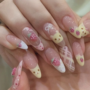 Handmade almond press-on nails featuring cute hand-painted strawberry and bear motifs