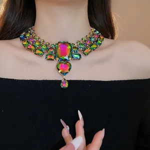 Statement necklace with colorful rhinestone heart and waterdrop pendants on model