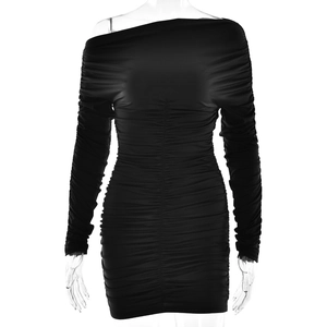 Elegant black bodycon long sleeve mini dress with ruched design on clear mannequin