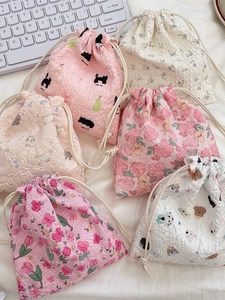 Cartoon seersucker drawstring bags with strawberry and animal prints for storage