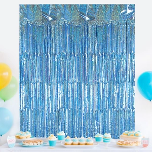 Blue holographic foil fringe curtain background for ocean themed party decorations