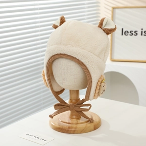 Detail of plush earflap hat for kids showing soft faux shearling and cute bear ears