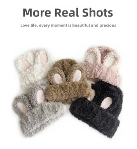 Detail showing plush rabbit ears on thick knit beanies in five assorted colors