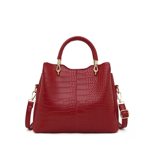 Elegant red crocodile pattern handbag for women with gold hardware and top handle