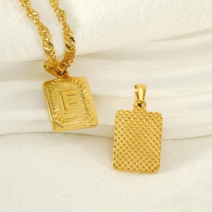 Gold stainless steel square pendant necklace featuring letter F and mesh texture