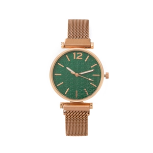 Detail of rose gold Milanese strap and green embossed leaf pattern watch dial