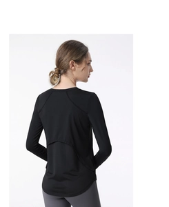Close-up of black breathable yoga top featuring back crescent mesh for ventilation
