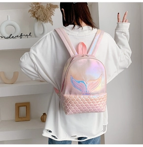 Detail of holographic pink mermaid backpack with tail embroidery and scale texture