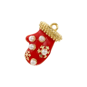 Detail of red Christmas glove pendant with golden snowflake and white faux pearls