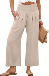 Gros plan sur la taille haute élastique plissée d'un pantalon large décontracté beige
