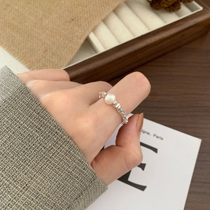 925 sterling silver ring with white pearl and irregular texture on hand
