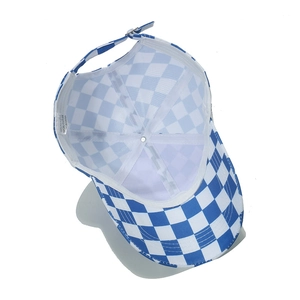 Detail view of the checkered baseball cap interior featuring white lining and washing label