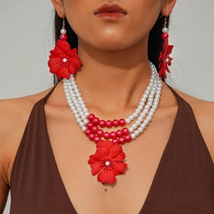Three-layer faux pearl necklace set with large red flower pendant and matching earrings
