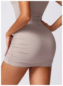 Detailed view of mocha high-waisted mini skirt with elegant side ruching and slim-fit cut
