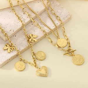Gold layered necklace set with Elizabeth portrait coin and heart charms on stone