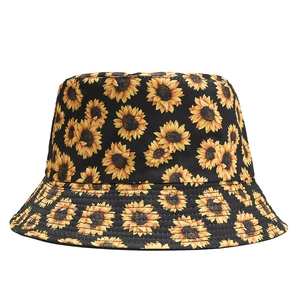 Close-up of floral bucket hat featuring detailed sunflower prints and stitched canvas brim