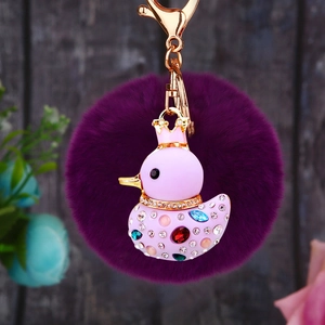 Pink rhinestone crown duck keychain with purple plush pom pom and golden hardware