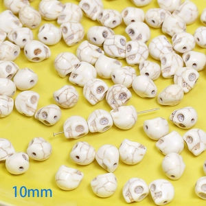 Close-up of 10mm skull-shaped white turquoise beads for DIY jewelry making and crafts