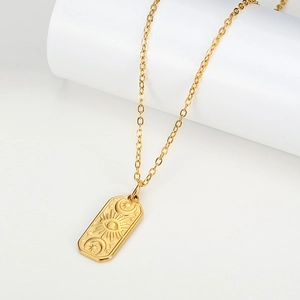 Vintage gold rectangular pendant necklace with celestial sun eye moon and star engraving