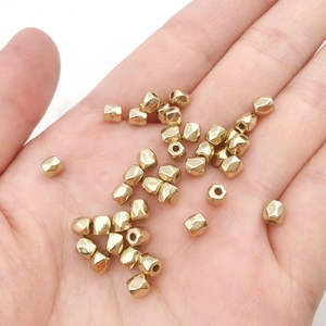 Detailed macro view of faceted gold CCB spacer beads for DIY jewelry making