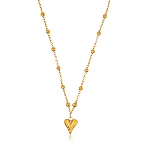 Elegant gold-plated titanium steel necklace featuring a heart pendant and bead chain