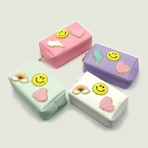 Portable chenille patch makeup bag set in four candy colors with gold glitter accents