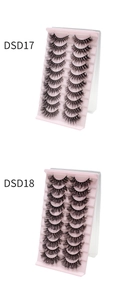 Close-up of DSD17 and DSD18 false eyelashes sets with dense natural curls in pink trays