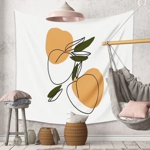 Detail view of Bohemian wall tapestry with abstract orange and olive fruit line patterns