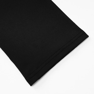 Close-up of double-stitched hem and fine fabric texture on a black slim dress