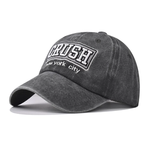 Detailed close-up of gray washed denim baseball cap with 3D white CRUSH embroidery