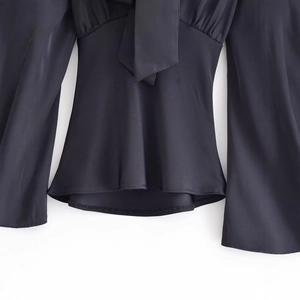 Women's chic black slim fit blouse with elegant bell sleeves and a stylish tie-neck bow