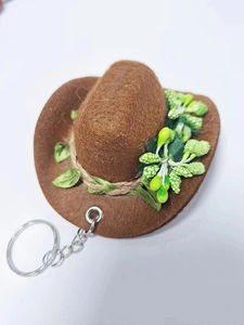 Brown felt cowboy hat keychain with green leaf accent and silver metal keyring