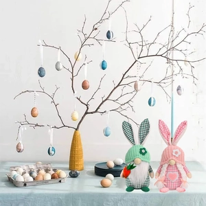 Detail of green and pink Easter gnomes with plaid bunny ears for holiday home decoration