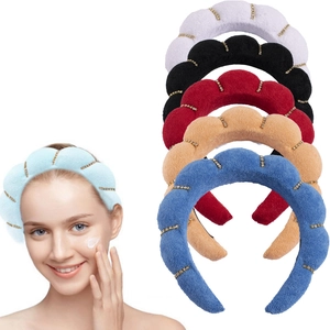 Detail of towel cloth twisted headbands showing diverse colors and rhinestone accents