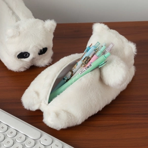 Detailed close-up of fluffy white plush dog pencil case with zipper and large capacity