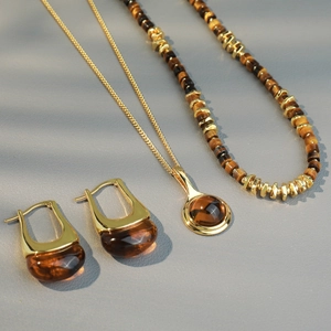 Vintage gold tiger eye jewelry set with beaded necklace, round pendant and earrings