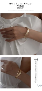 Detailed view of geometric crisscross gold metal bracelet on a model wrist