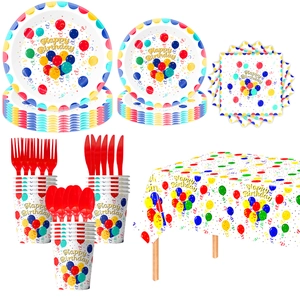 Detailed view of the birthday party tableware set with colorful balloon pattern and cutlery