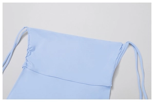 Detailed view of light blue yoga shorts featuring adjustable side drawstring and ruched texture