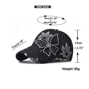 Detail of black lace baseball cap featuring rhinestone butterfly and breathable mesh