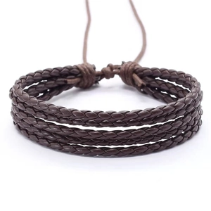Detailed view of dark brown multi-layer braided leather men's bracelet with adjustable cord knot