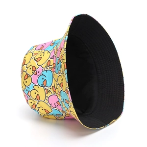 Detail of graffiti bucket hat featuring colorful cartoon duck pattern and black lining