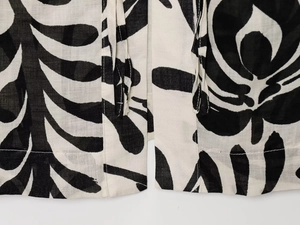 Detailed view of the hem stitching and breathable floral print fabric on pants