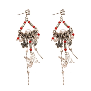 Vintage bohemian silver drop earrings with red beads, pearls, and butterfly tassels