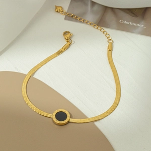 Golden flat snake chain anklet with Roman numeral black disc charm for women