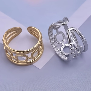 Detailed macro view of gold and silver hollow chain design open rings in 304 stainless steel