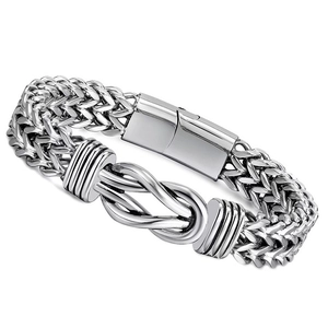 Detailed macro view of silver punk stainless steel double chain bracelet with knot design