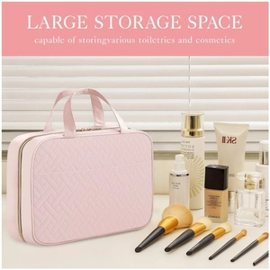 Pink quilted hanging toiletry bag with large storage space for travel cosmetics